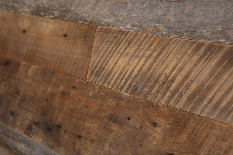 Brown and grey reclaimed wood. Natural grain and aging. Noticeable saw blade marks